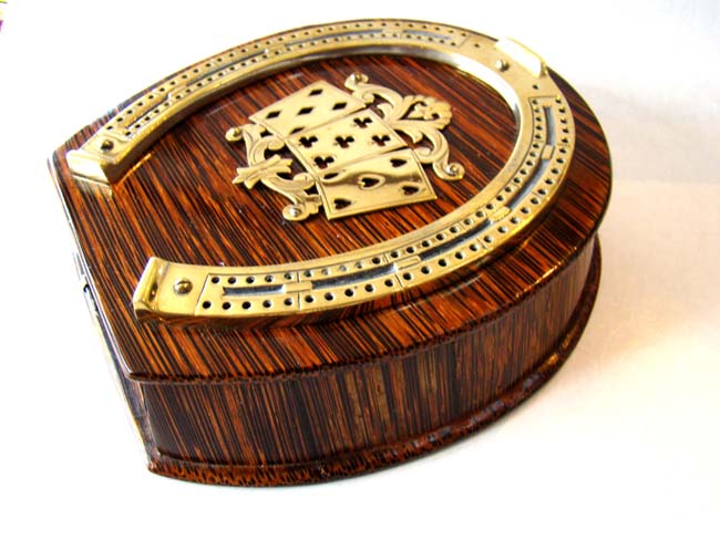 An exquisite Victorian zebra wood cribbage board circa 1890.